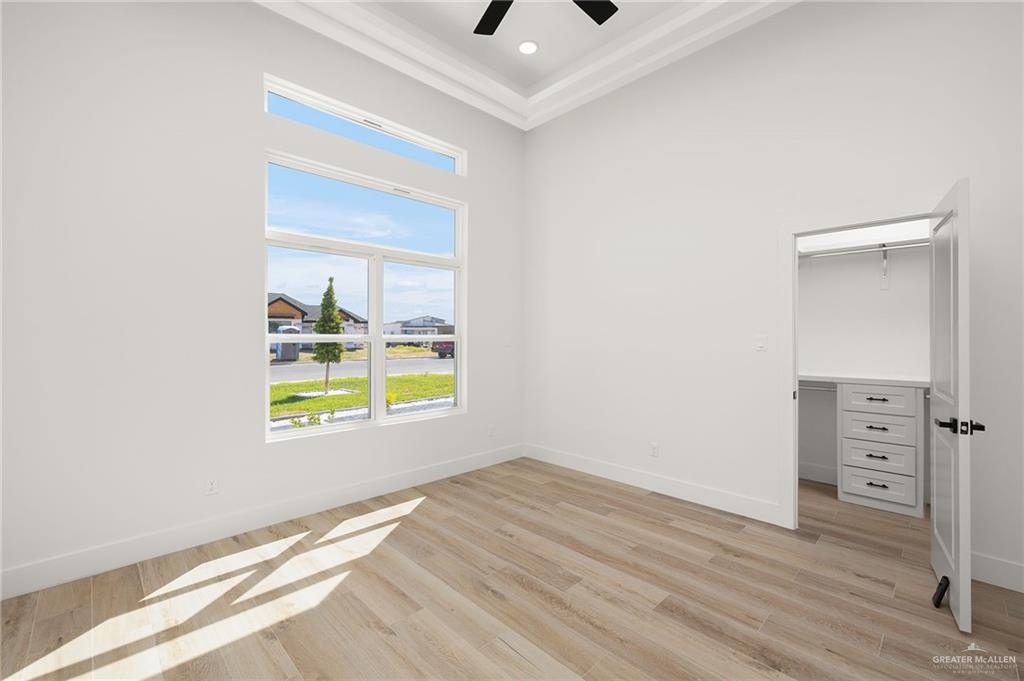 2525 Trinity Avenue McAllen, TX 78504 - Photo 14 of 33 an empty room with a window and wooden floor