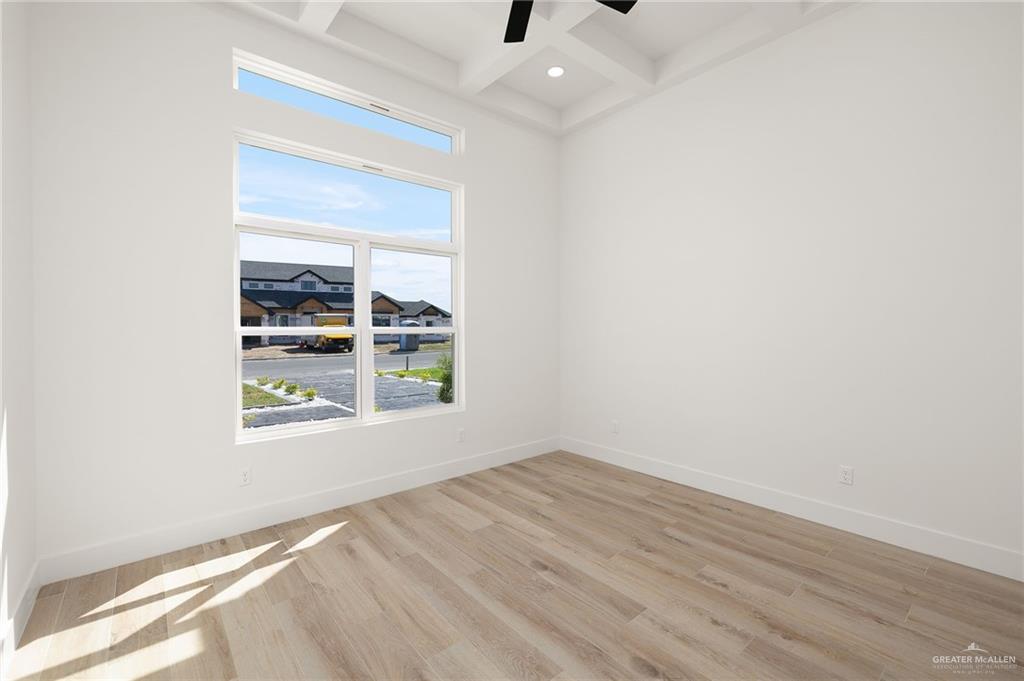 2525 Trinity Avenue McAllen, TX 78504 - Photo 15 of 33 an empty room with wooden floor and windows