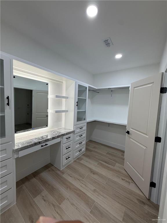 2525 Trinity Avenue McAllen, TX 78504 - Photo 19 of 33 a room with cabinets and wooden floor