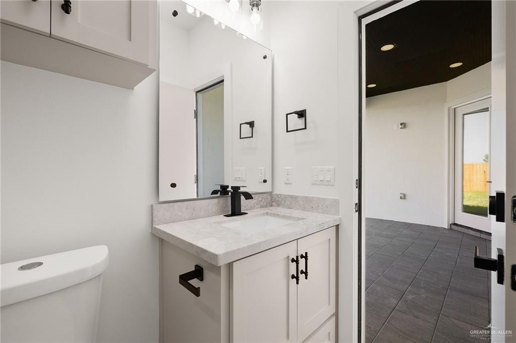 2525 Trinity Avenue McAllen, TX 78504 - Photo 23 of 33 a bathroom with a sink vanity and a mirror