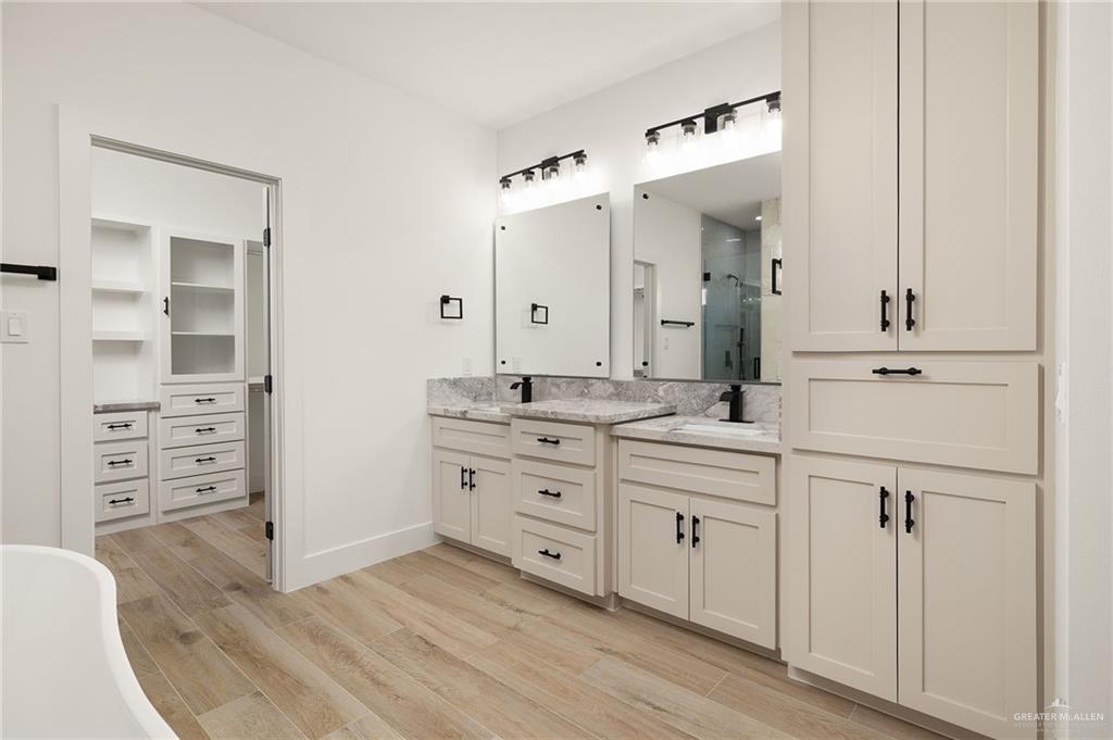 2525 Trinity Avenue McAllen, TX 78504 - Photo 24 of 33 a spacious bathroom with a granite countertop sink mirror and