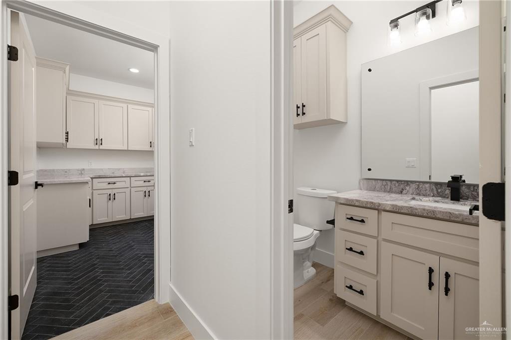 2525 Trinity Avenue McAllen, TX 78504 - Photo 25 of 33 a view of cabinets a sink and a stove in a room