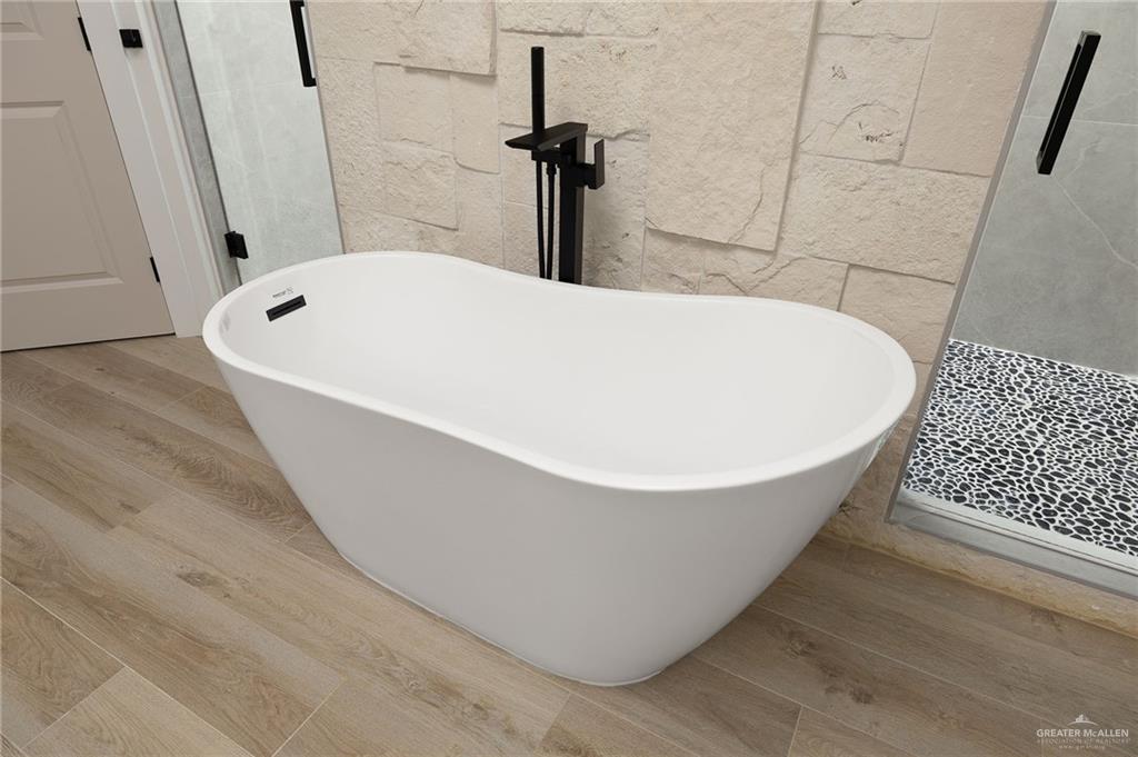 2525 Trinity Avenue McAllen, TX 78504 - Photo 28 of 33 a white bath tub sitting in a bathroom