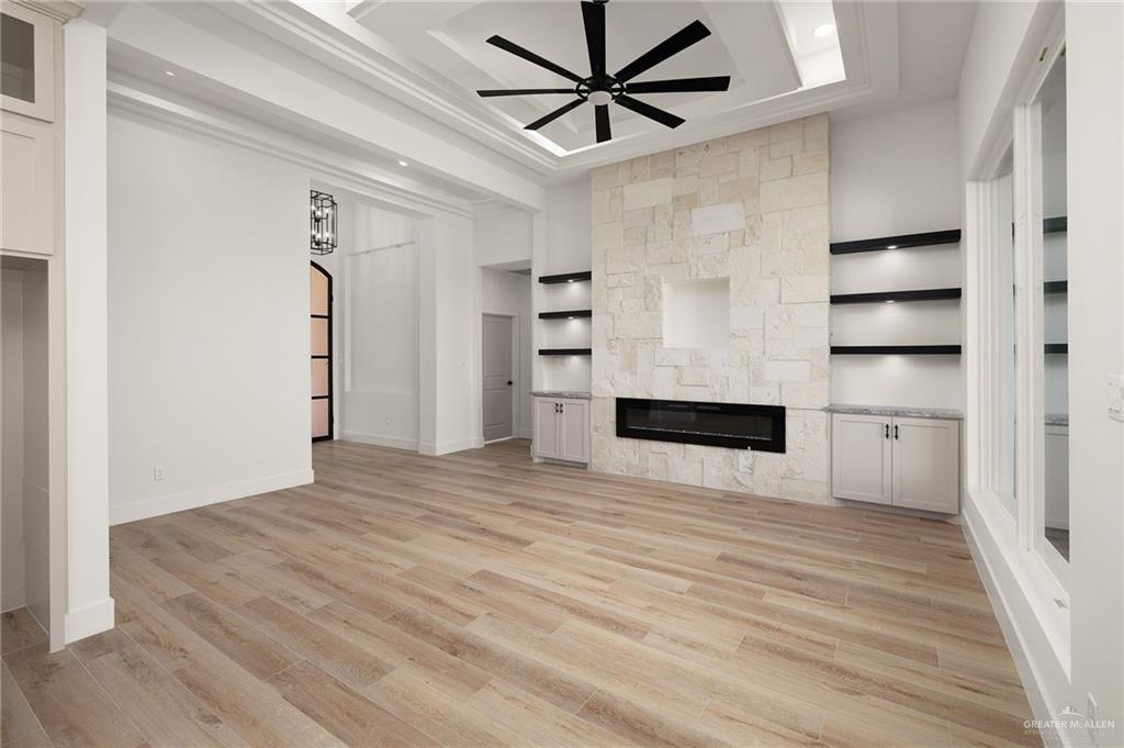 2525 Trinity Avenue McAllen, TX 78504 - Photo 3 of 33 a view of a livingroom with wooden floor and a ceiling fan