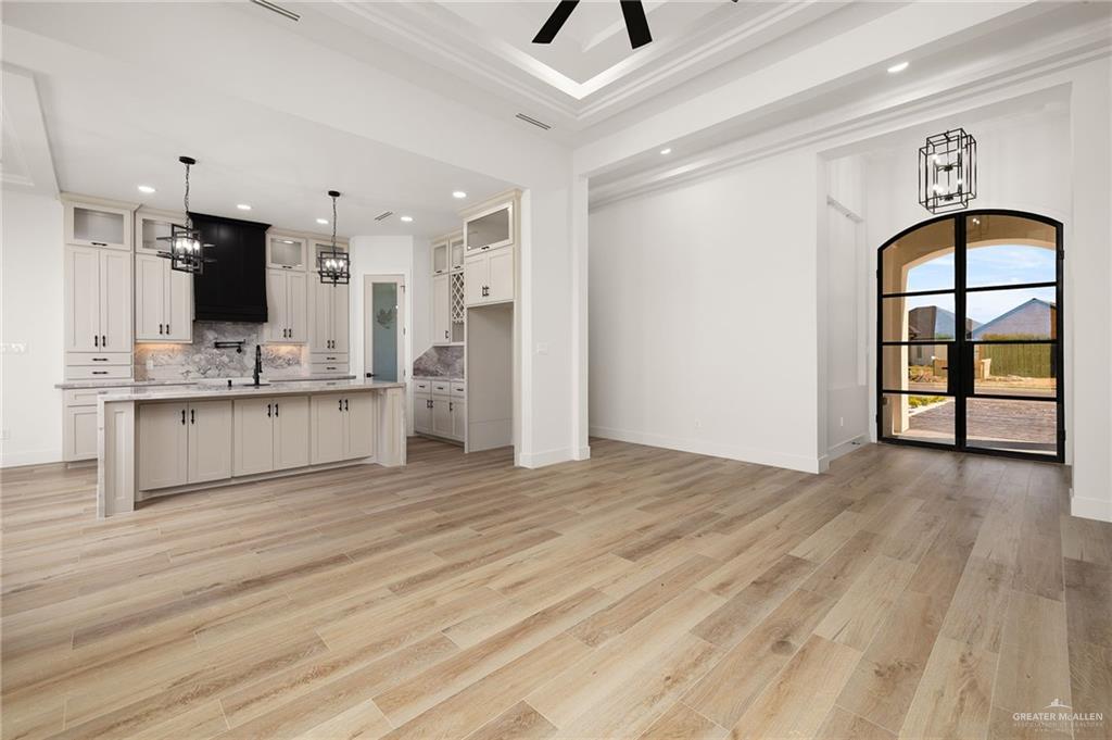 2525 Trinity Avenue McAllen, TX 78504 - Photo 6 of 33 a view of kitchen with cabinets and flat screen tv