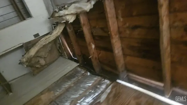 a room with a wooden floor and furniture