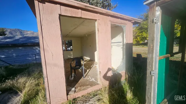 a roof deck with table and chairs