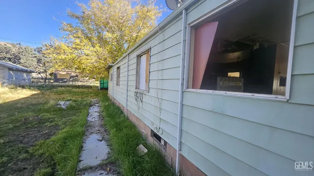 a view of a backyard of the house