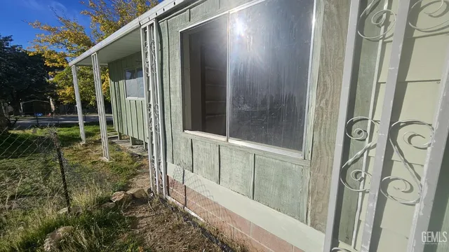 a view of a glass door and a yard