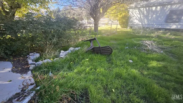 a backyard of a house with lots of green space and garden view