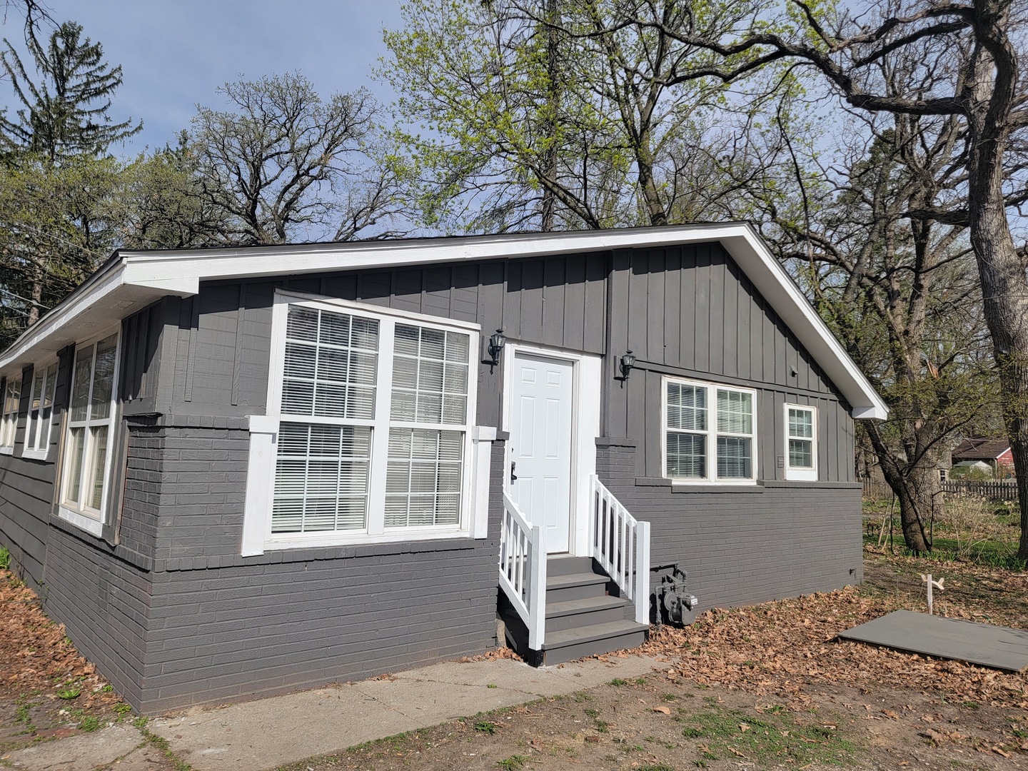 511 North River Road McHenry, IL 60051 - Photo 1 of 22 a front view of a house with a yard