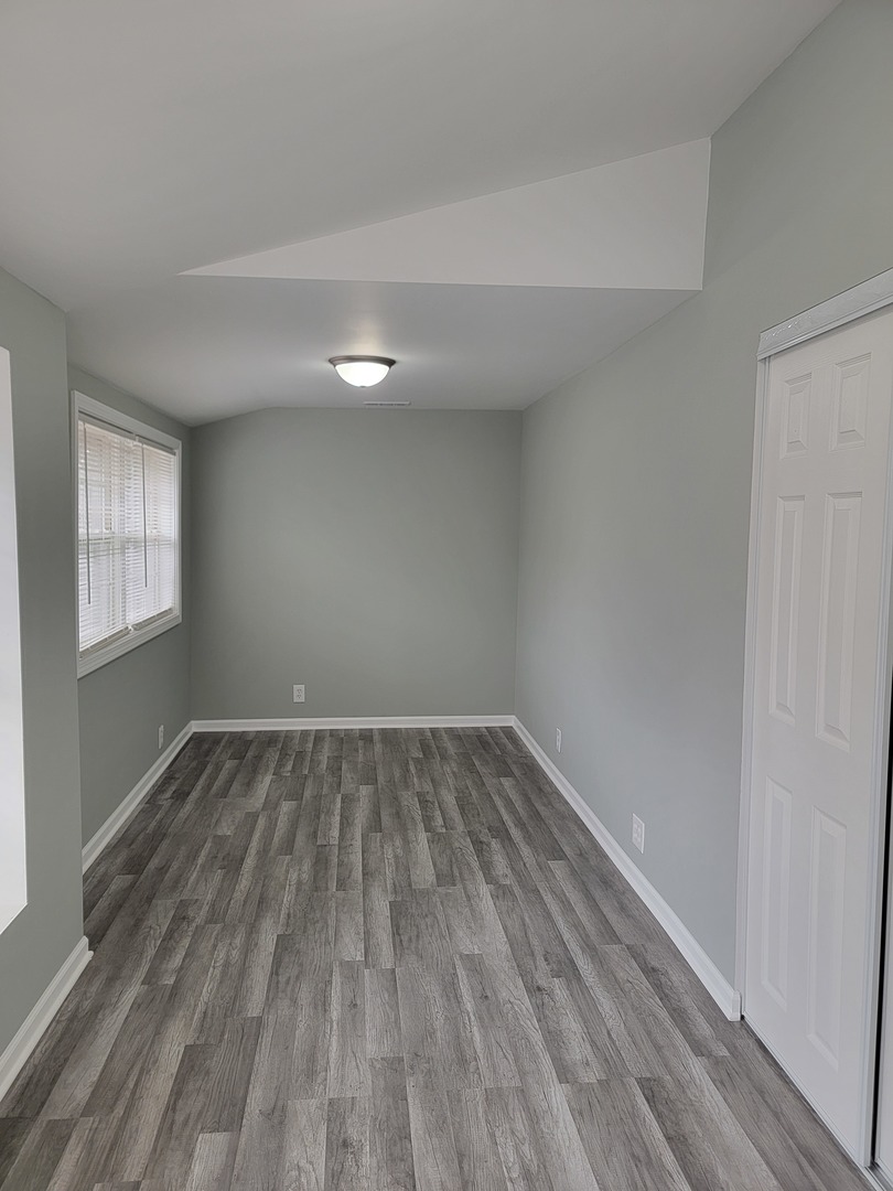 511 North River Road McHenry, IL 60051 - Photo 14 of 22 a view of an empty room and wooden floor