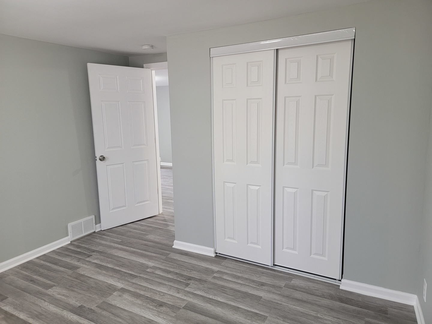511 North River Road McHenry, IL 60051 - Photo 16 of 22 a view of an empty room with wooden floor