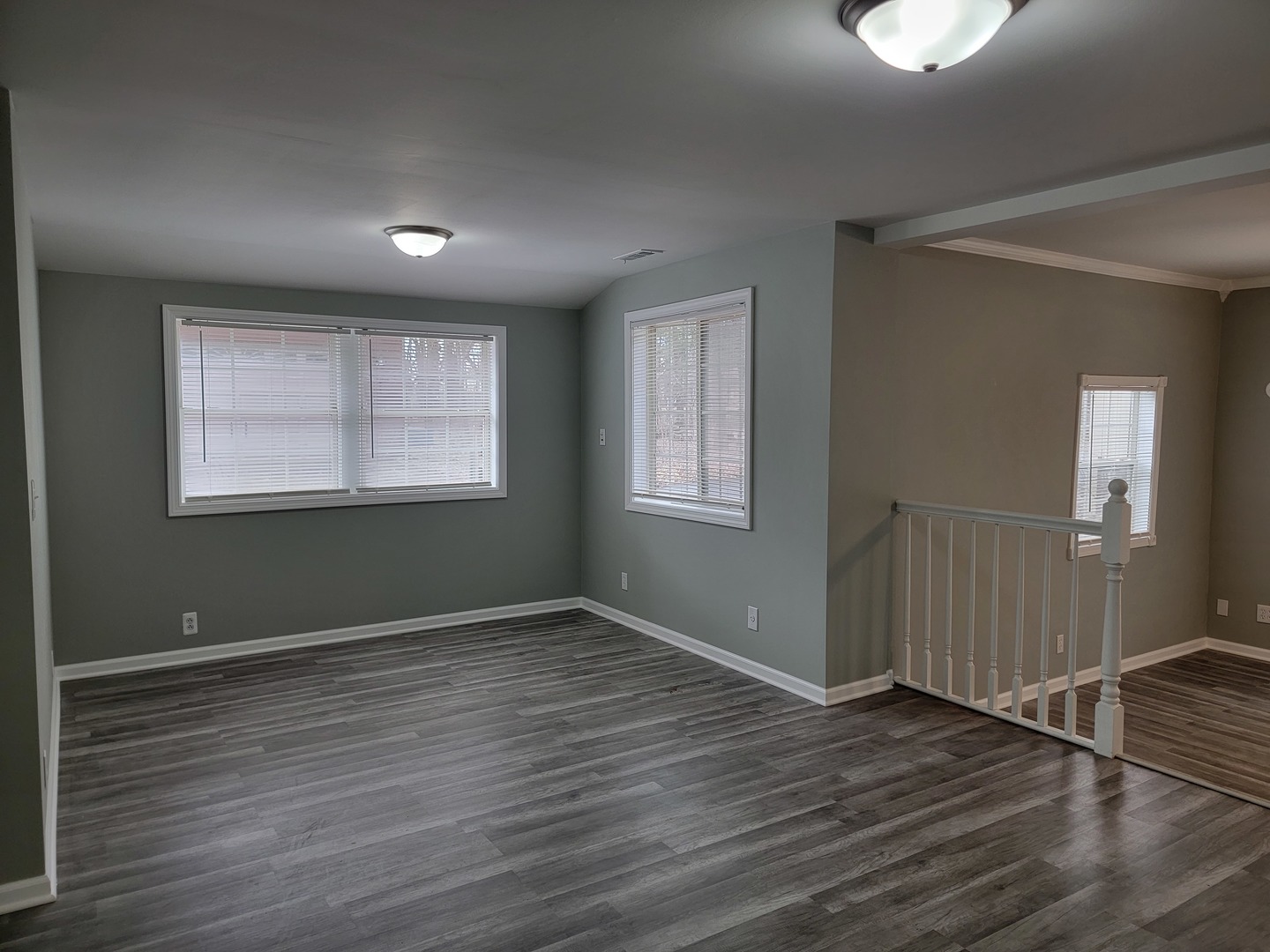 511 North River Road McHenry, IL 60051 - Photo 2 of 22 an empty room with wooden floor and windows
