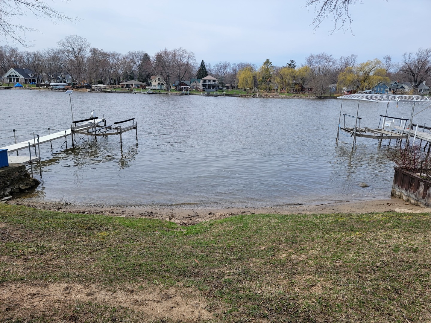 511 North River Road McHenry, IL 60051 - Photo 21 of 22 a view of a lake with houses in the back