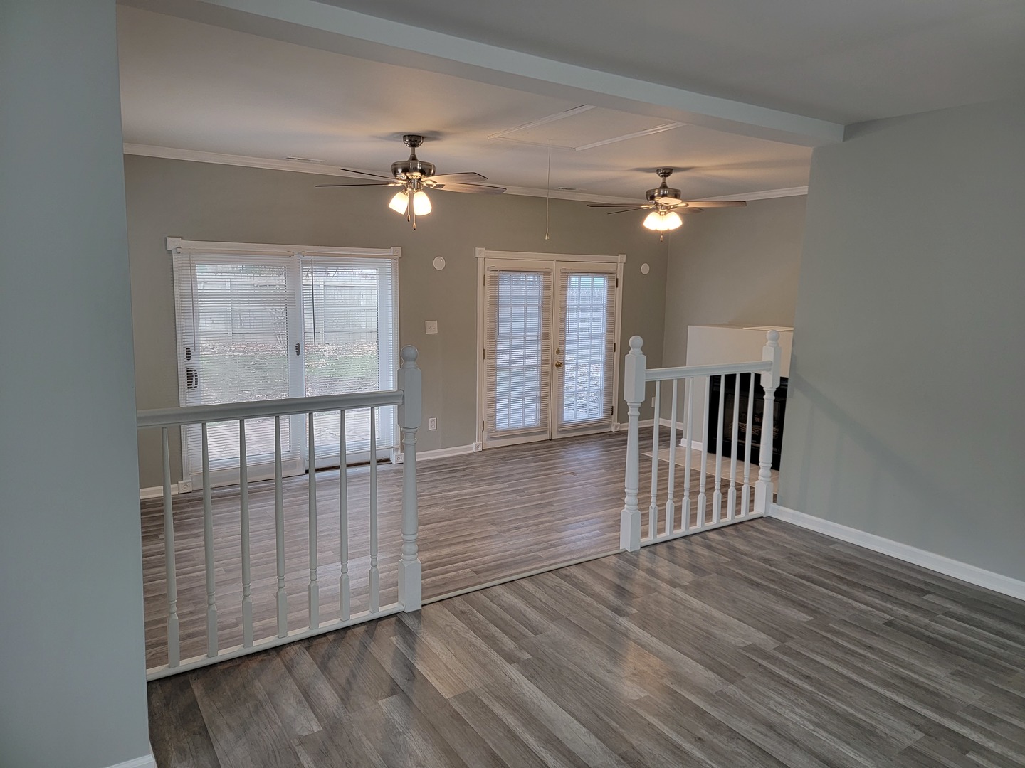 511 North River Road McHenry, IL 60051 - Photo 3 of 22 wooden floor in an empty room with a window