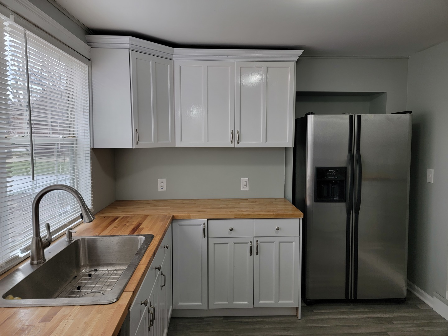 511 North River Road McHenry, IL 60051 - Photo 7 of 22 a kitchen with granite countertop a sink stainless steel appliances and cabinets