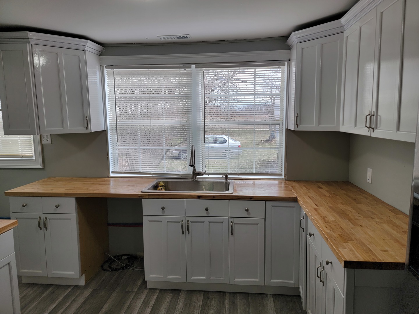 511 North River Road McHenry, IL 60051 - Photo 8 of 22 a kitchen with granite countertop cabinets stainless steel appliances a sink and a window