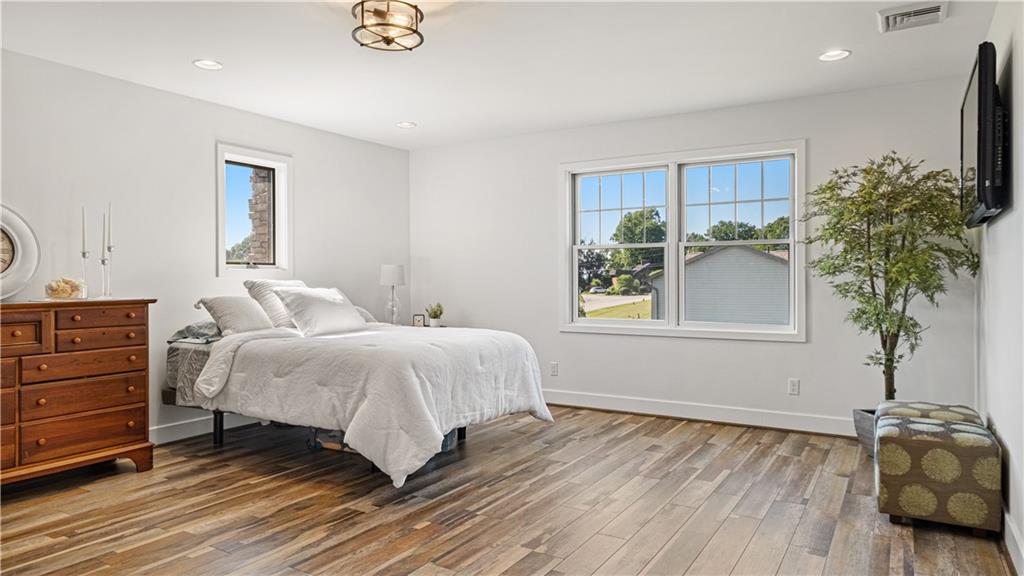 695 North Ben Franklin Road Indiana, PA 15701 - Photo 15 of 25 a bedroom with a bed and a potted plant
