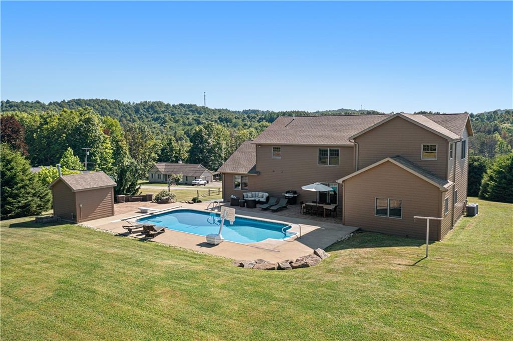 695 North Ben Franklin Road Indiana, PA 15701 - Photo 21 of 25 a view of a house with pool and a yard