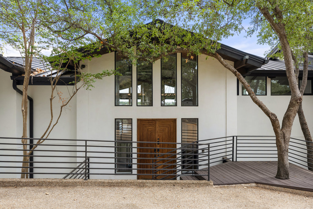 6905 Ladera Norte Austin, TX 78731 - Photo 12 of 40 a front view of a house with garage
