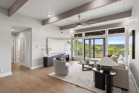 a living room with furniture and a large window