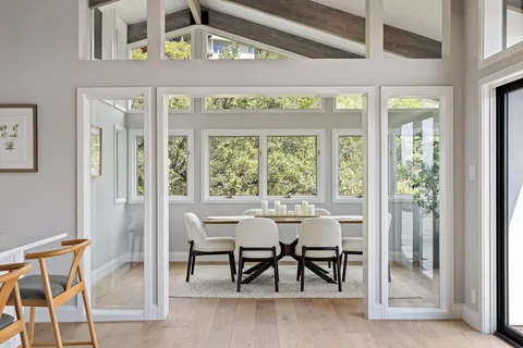 a dining room with furniture and window