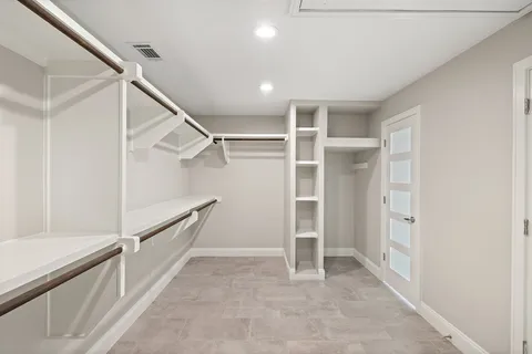a view of entryway with stairs and white walls