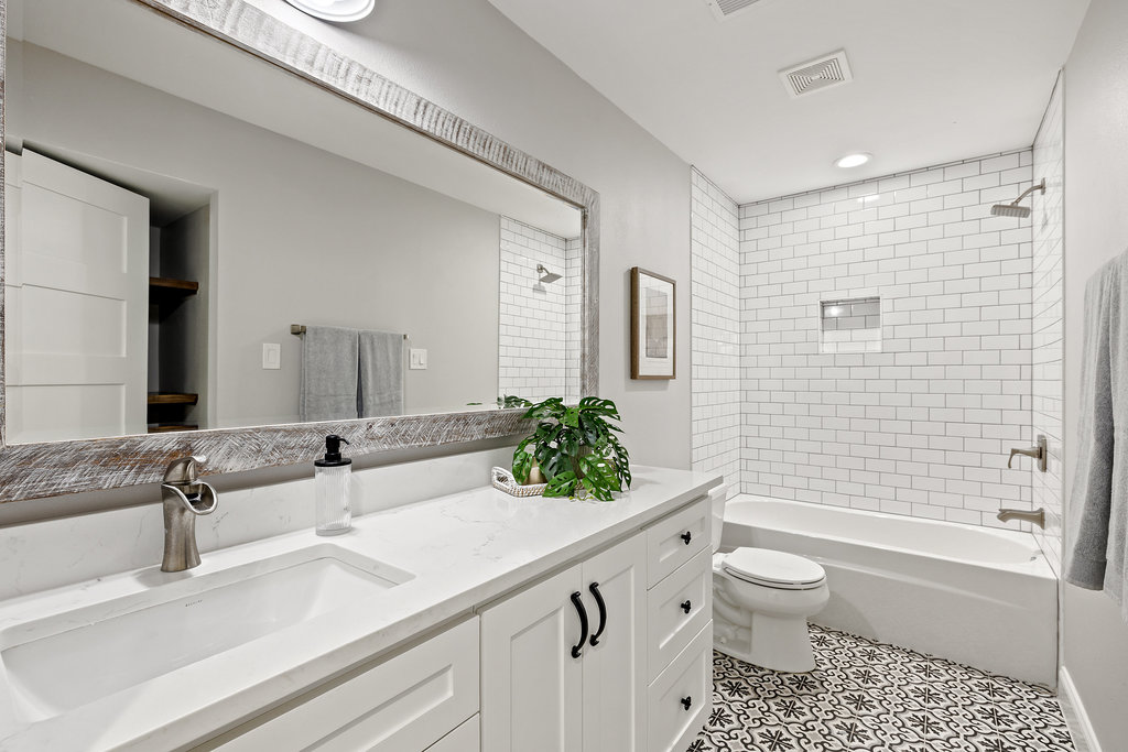 6905 Ladera Norte Austin, TX 78731 - Photo 29 of 40 a bathroom with a sink a toilet and shower