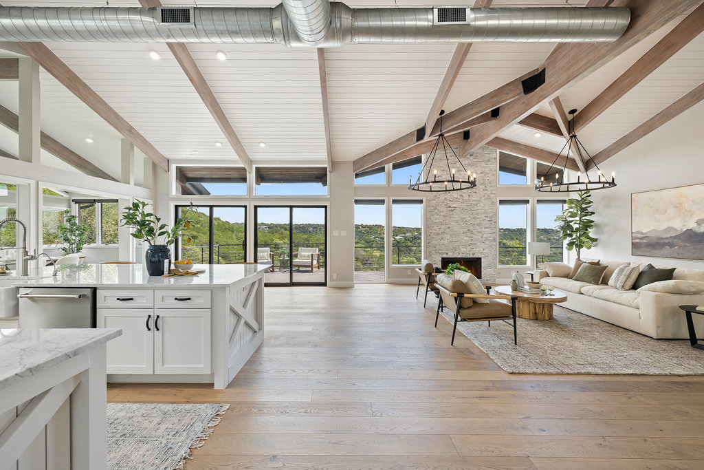 6905 Ladera Norte Austin, TX 78731 - Photo 3 of 40 a living room with furniture large windows and wooden floor