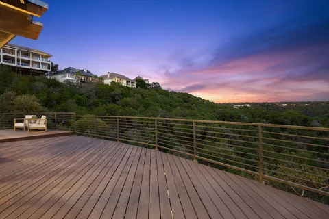 a view of a house with a yard and balcony