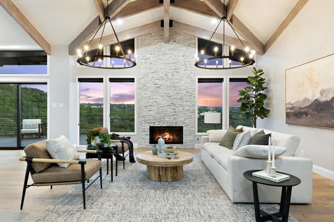 a living room with furniture fireplace and outdoor view