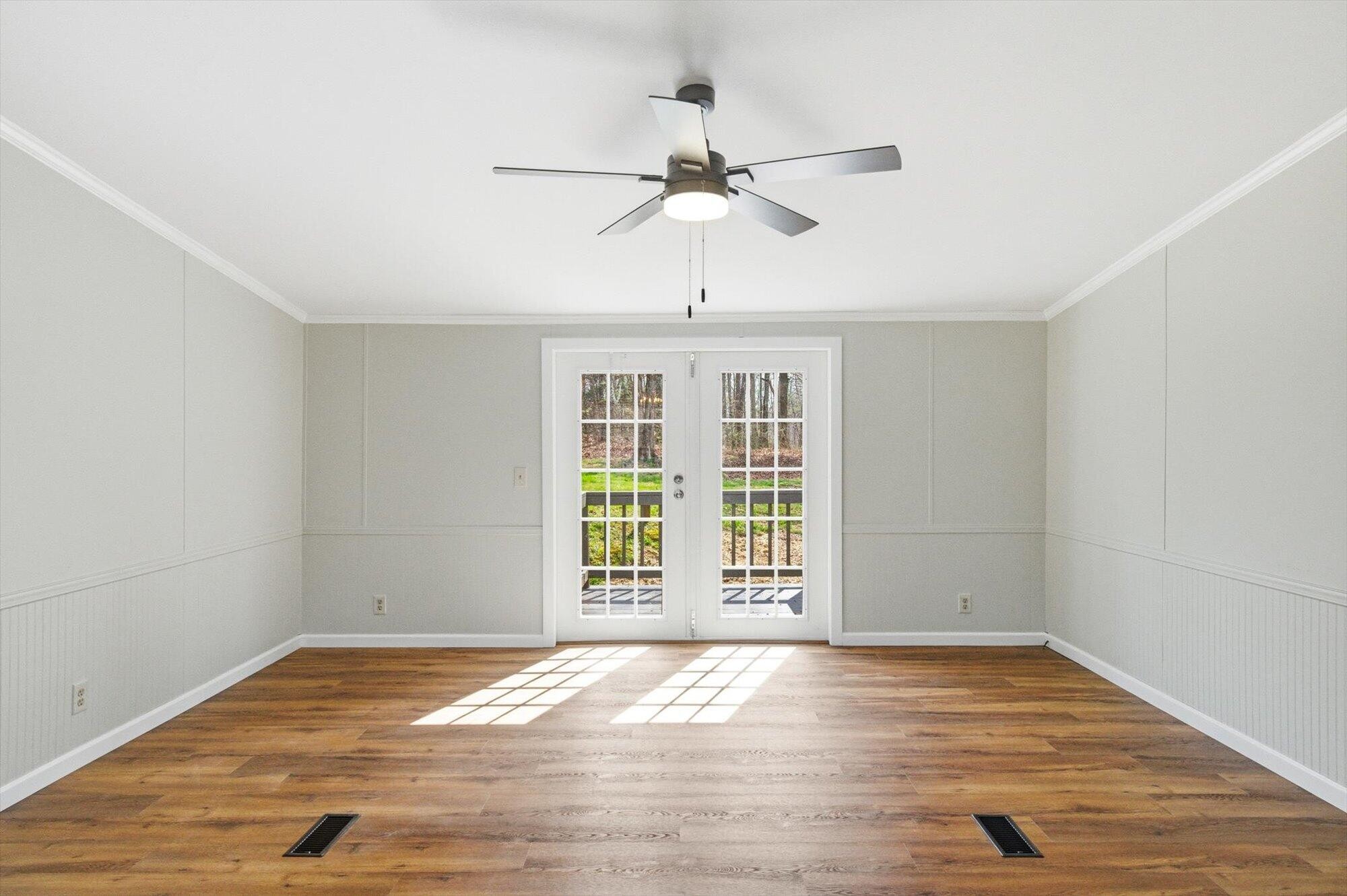 64 County Road 100 Decatur, TN 37322 - Photo 6 of 43 a view of empty room with wooden floor and fan