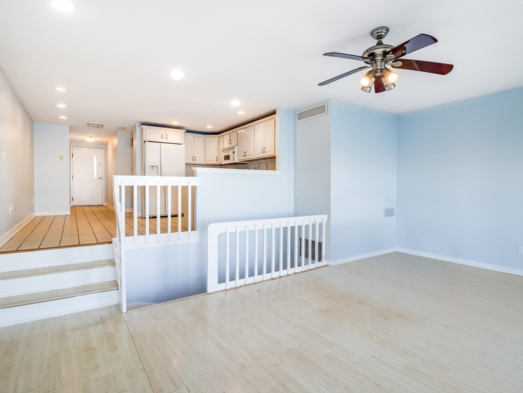 16 Milford Street, Unit 9 Hull, MA 02045 - Photo 12 of 42 a view of entryway and hall with a chandelier