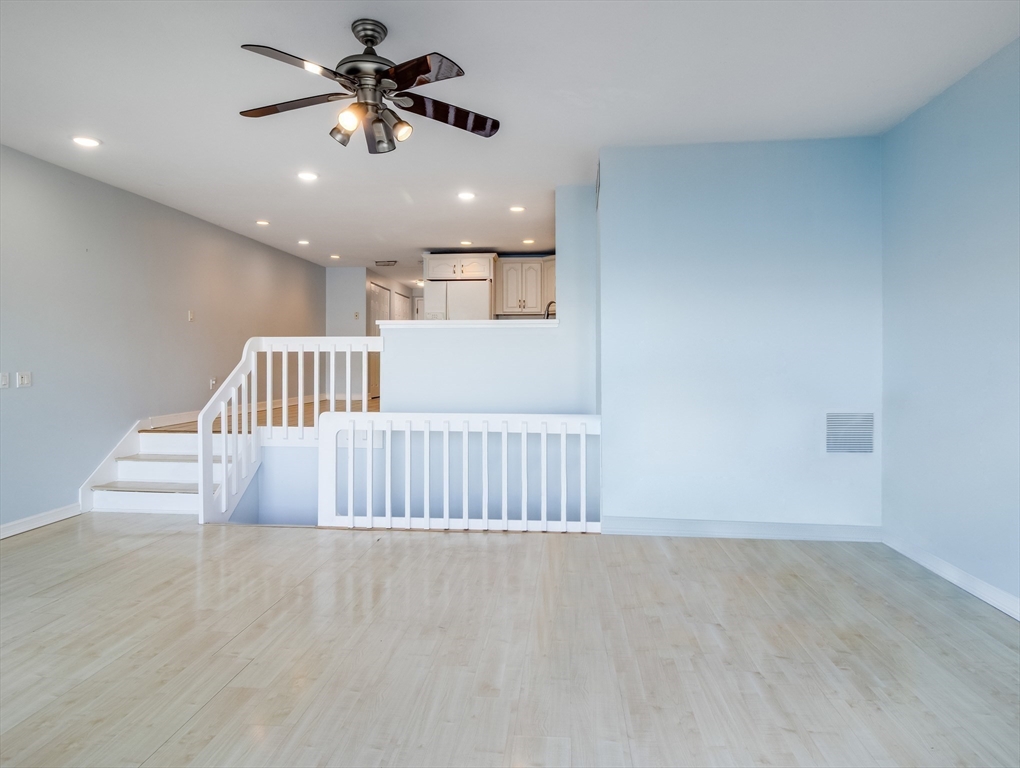 16 Milford Street, Unit 9 Hull, MA 02045 - Photo 14 of 42 a view of entryway and hall with a chandelier fan