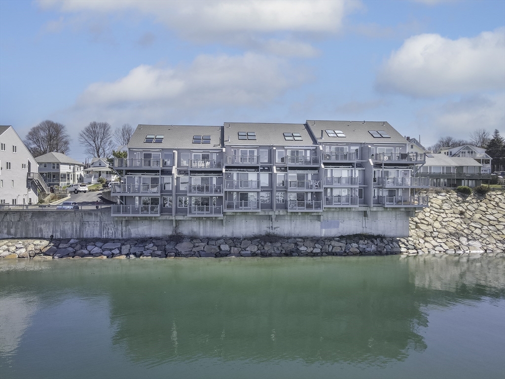 16 Milford Street, Unit 9 Hull, MA 02045 - Photo 2 of 42 a view of a water with a building in the background