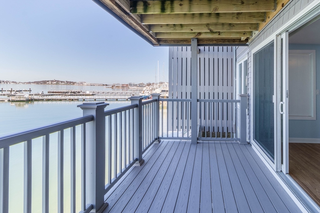 16 Milford Street, Unit 9 Hull, MA 02045 - Photo 35 of 42 a view of a balcony with wooden floor