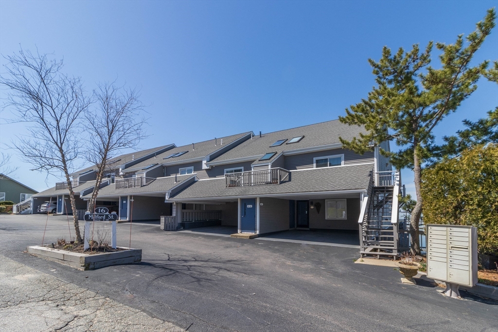 16 Milford Street, Unit 9 Hull, MA 02045 - Photo 4 of 42 a front view of a house with a yard
