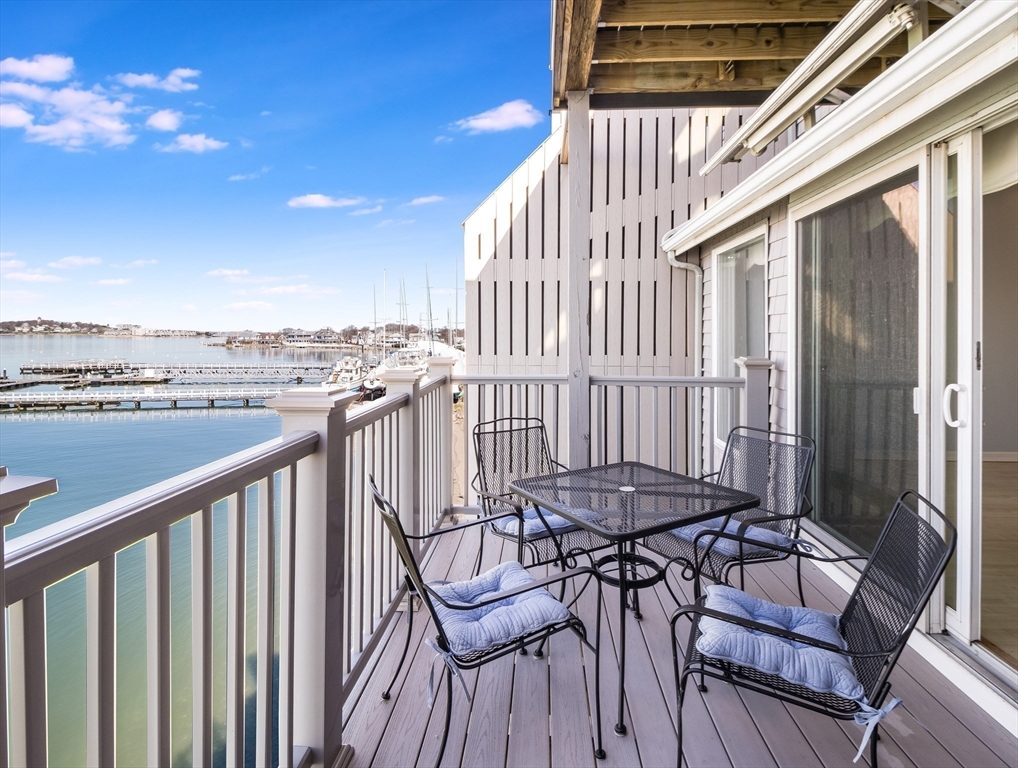 16 Milford Street, Unit 9 Hull, MA 02045 - Photo 6 of 42 a view of a chairs and table in the balcony