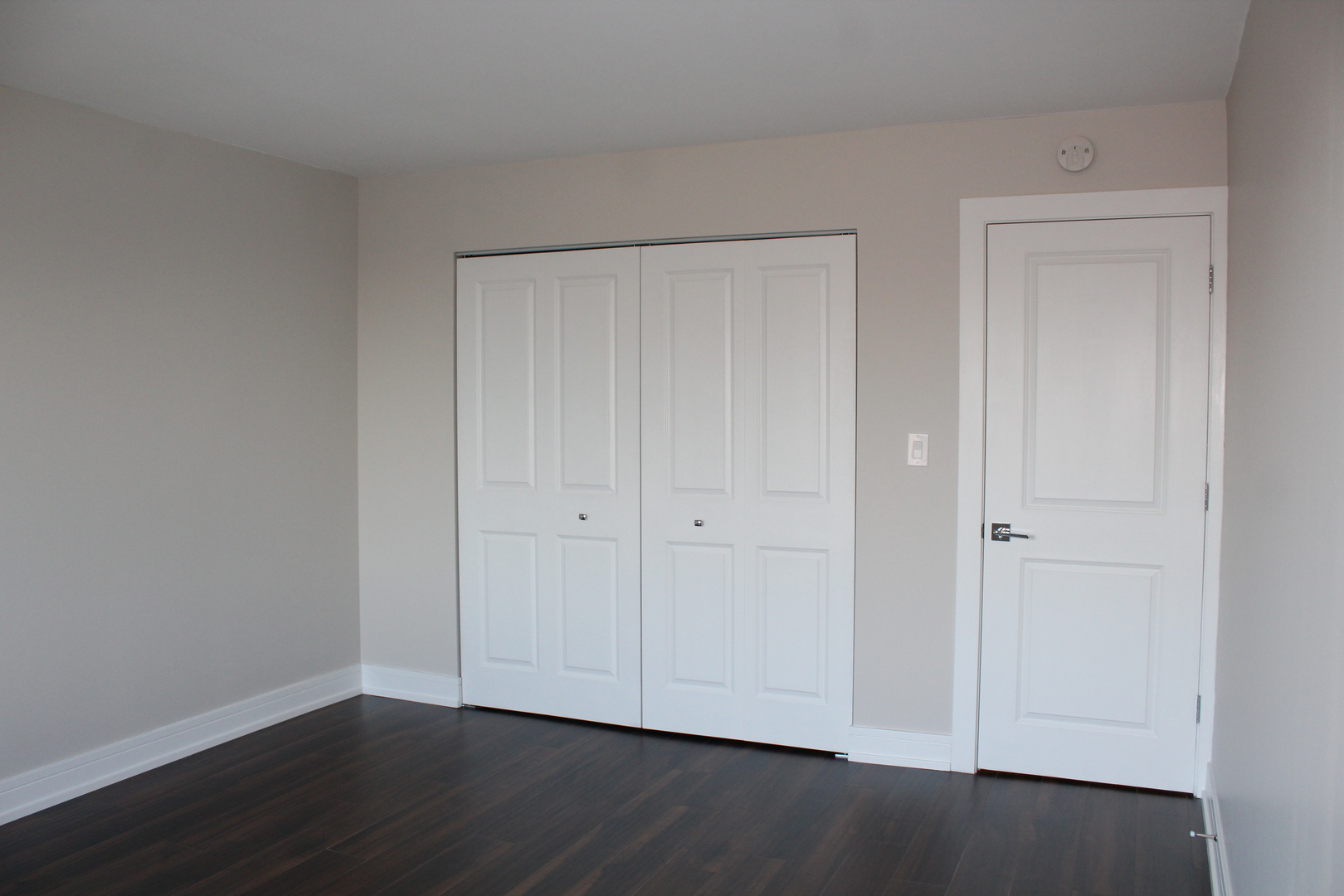 1605 East Central Road, Unit 413B Arlington Heights, IL 60005 - Photo 9 of 15 a view of an empty room with wooden floor