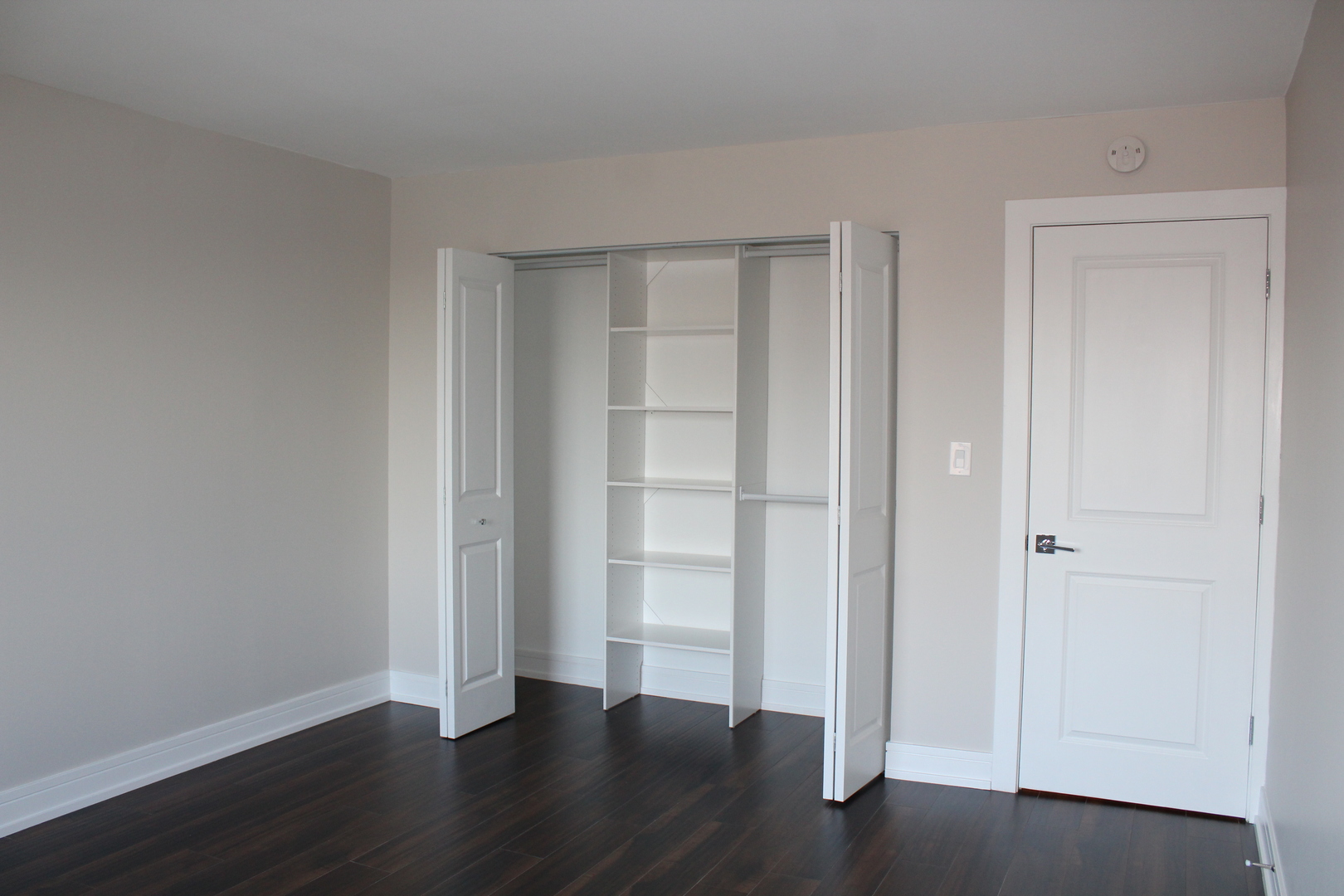 1605 East Central Road, Unit 413B Arlington Heights, IL 60005 - Photo 10 of 15 a view of an empty room with wooden floor
