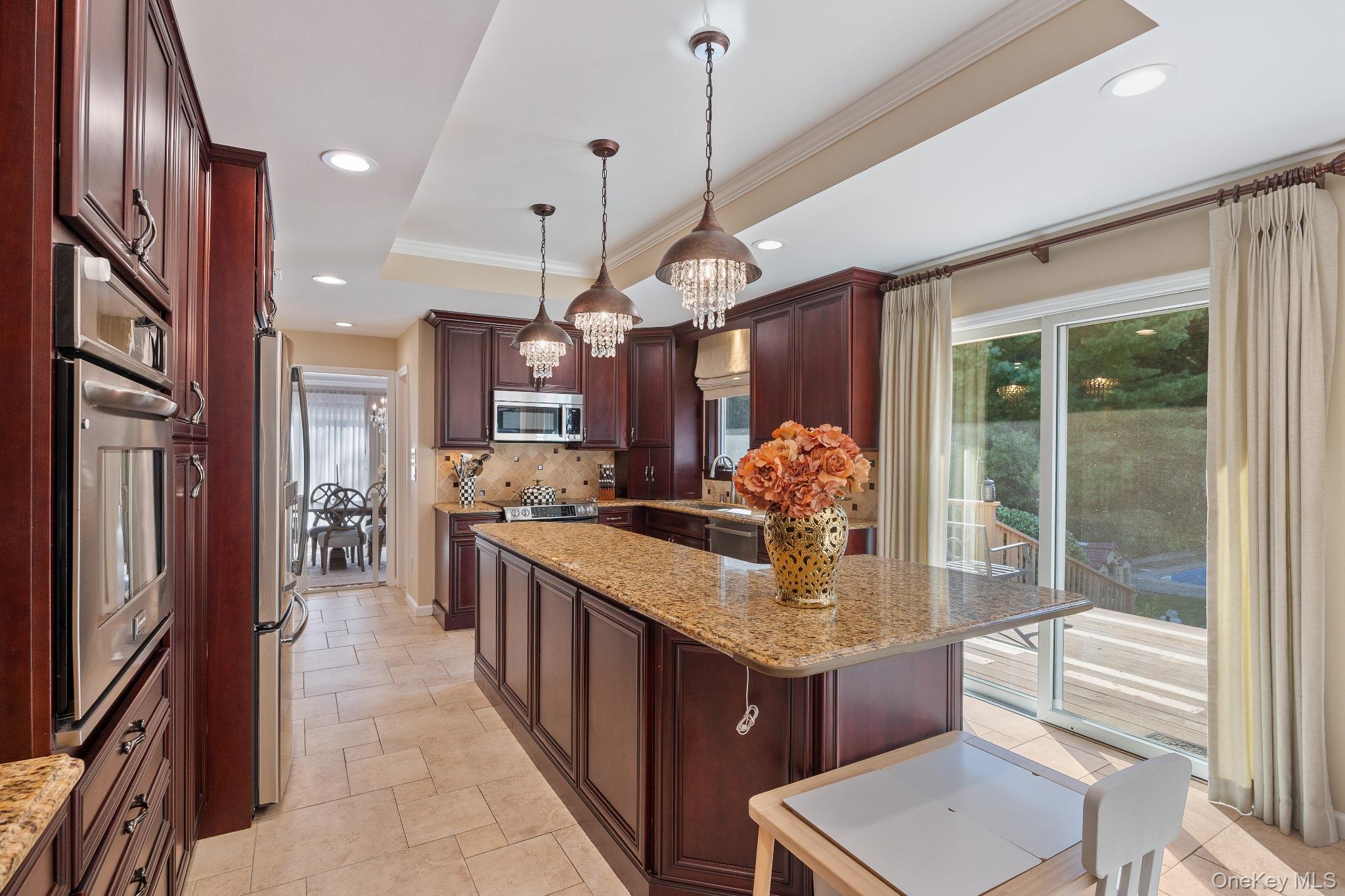 461 Wolf Hill Road Dix Hills, NY 11746 - Photo 11 of 37 a kitchen with granite countertop a stove a sink dishwasher and a refrigerator