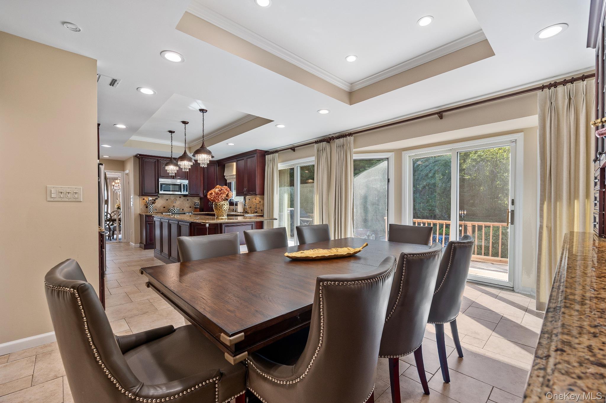 461 Wolf Hill Road Dix Hills, NY 11746 - Photo 14 of 37 a view of a dining room with furniture and a large window