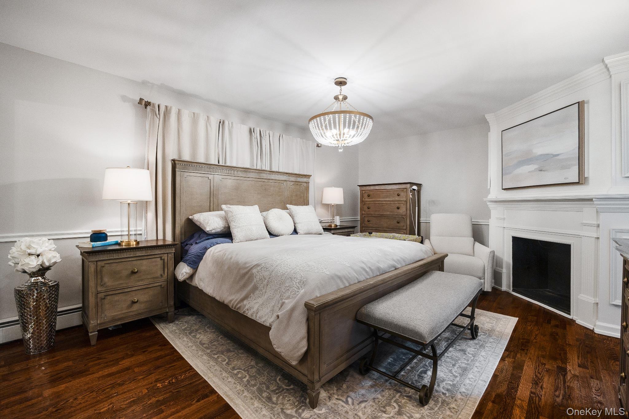 461 Wolf Hill Road Dix Hills, NY 11746 - Photo 17 of 37 a bedroom with bed and a fireplace