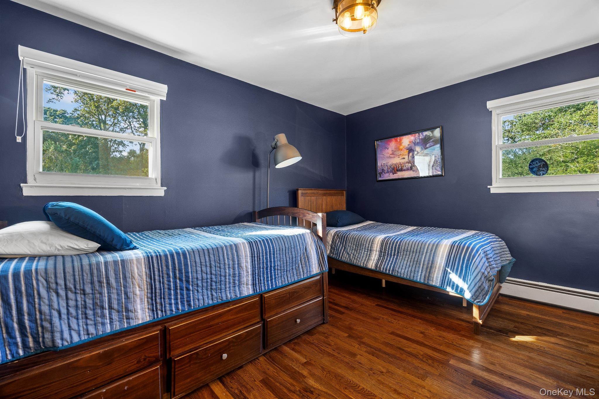 461 Wolf Hill Road Dix Hills, NY 11746 - Photo 23 of 37 a bedroom with two beds and a potted plant