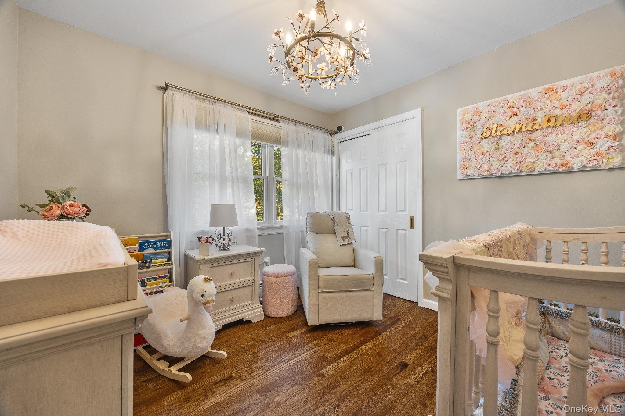 461 Wolf Hill Road Dix Hills, NY 11746 - Photo 24 of 37 a room with furniture and a chandelier