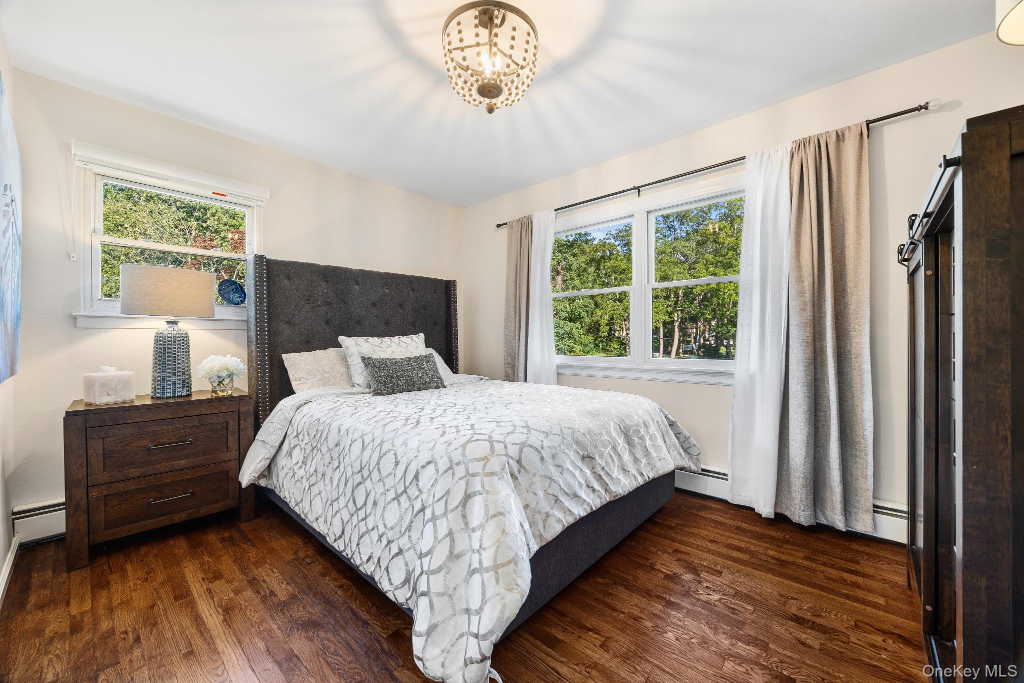 461 Wolf Hill Road Dix Hills, NY 11746 - Photo 25 of 37 a bedroom with a bed dresser and a window
