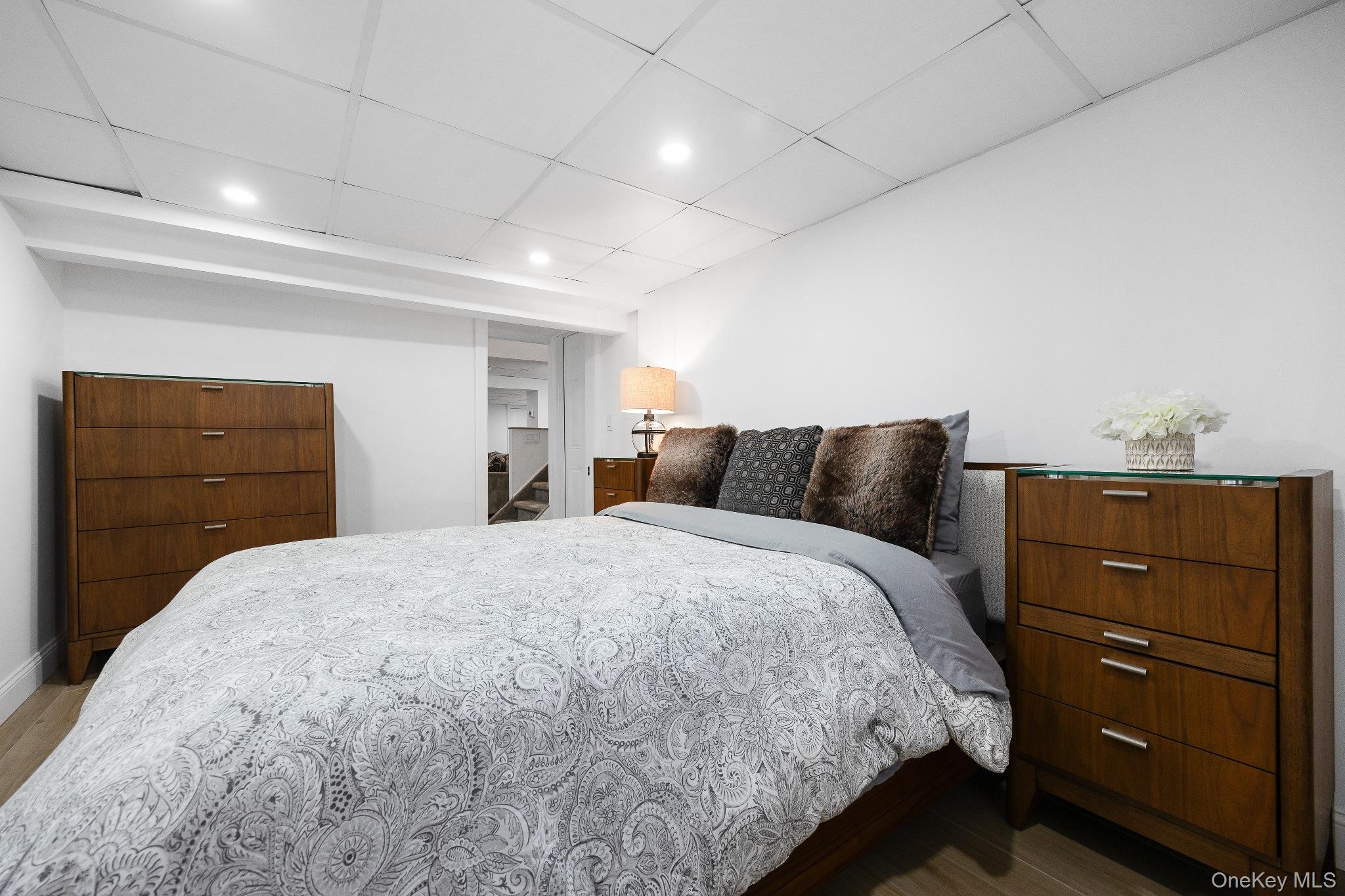 461 Wolf Hill Road Dix Hills, NY 11746 - Photo 30 of 37 a bedroom with a bed and a dresser