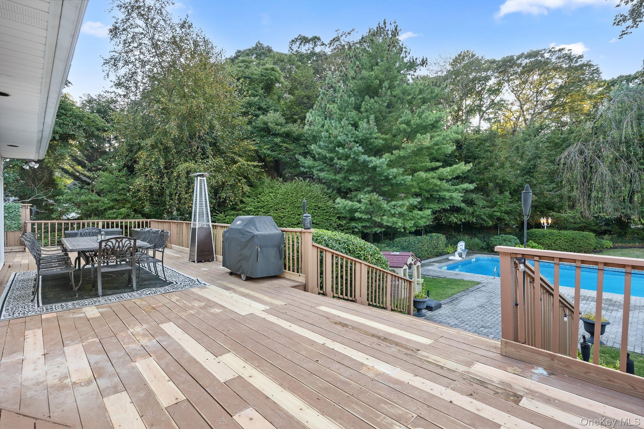 461 Wolf Hill Road Dix Hills, NY 11746 - Photo 32 of 37 a view of a chair and tables on the roof deck