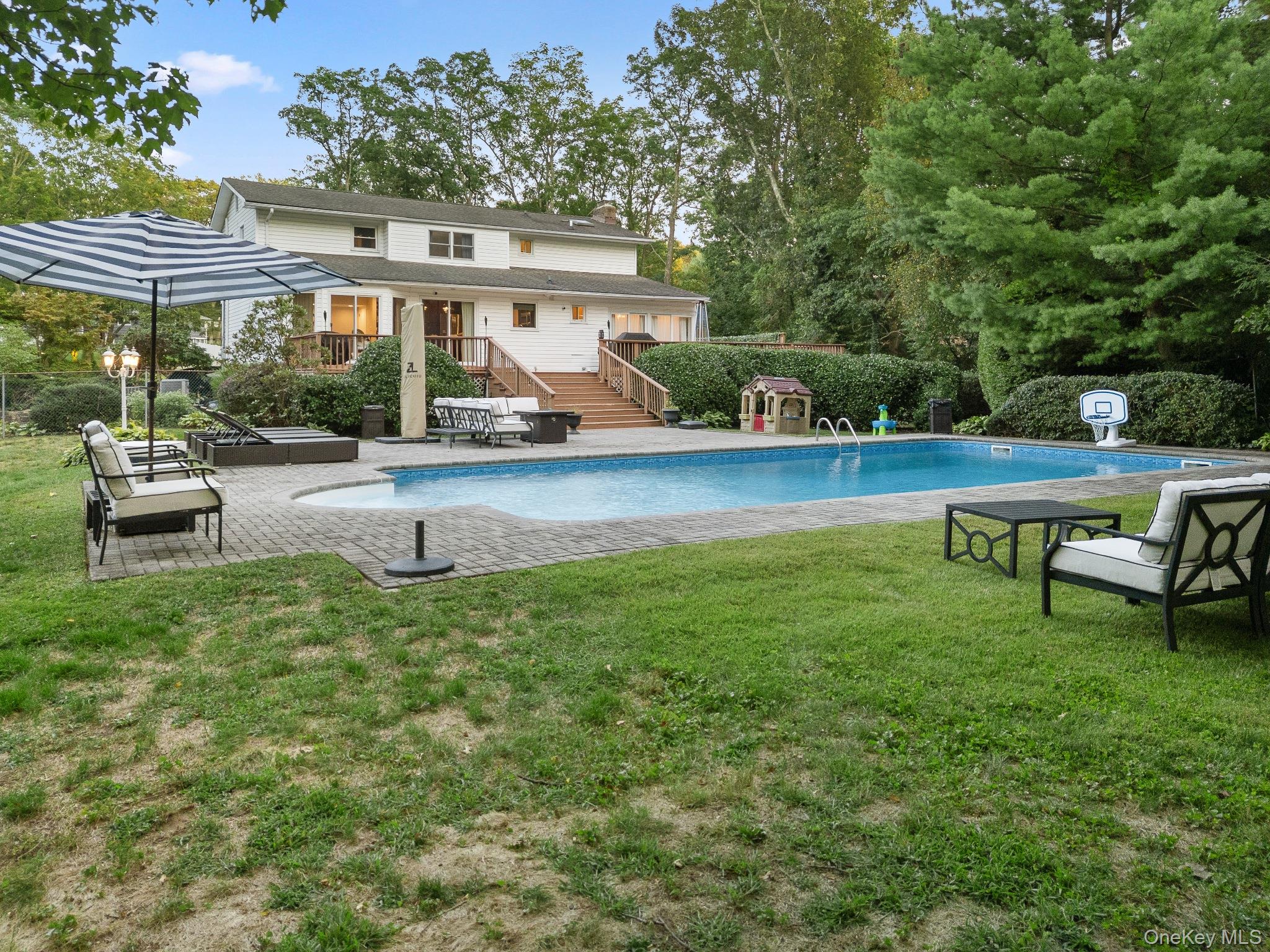 461 Wolf Hill Road Dix Hills, NY 11746 - Photo 34 of 37 a view of a house with backyard porch and sitting area